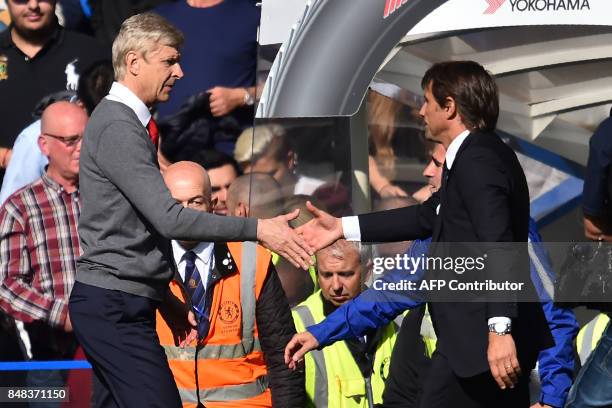 Chelsea's Italian head coach Antonio Conte shakes hands with Arsenal's French manager Arsene Wenger after the English Premier League football match...