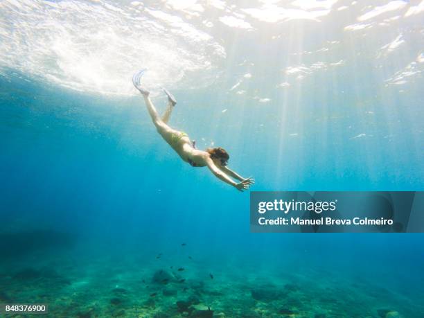 Woman diving in Greece