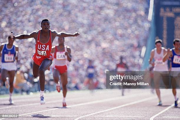 Summer Olympics: USA Carl Lewis in action, crossing finish line and winning Men's 4x100M Relay Final at Memorial Coliseum. Los Angeles, CA...