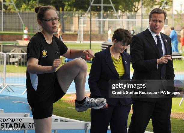 Prime Minister David Cameron walks with Ruth Davidson, leader of the Scottish Conservative and Unionist Party, as he meets young athletes at a sports...