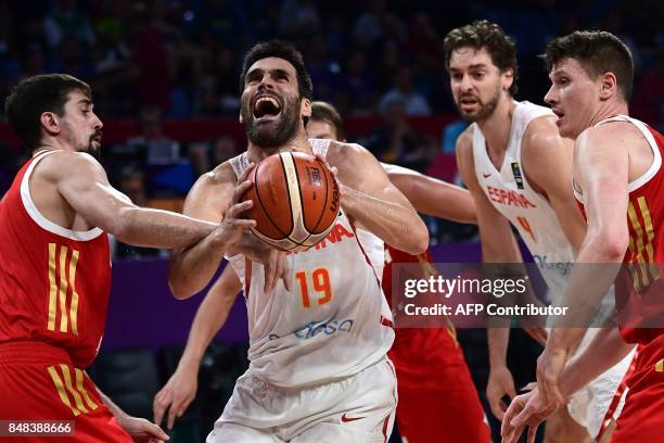 Spain's forward Fernando San Emeterio vies with Russia's guard Alexey Shved and Semen Antonov during the FIBA Euro basket 2017 men's 3rd game match...