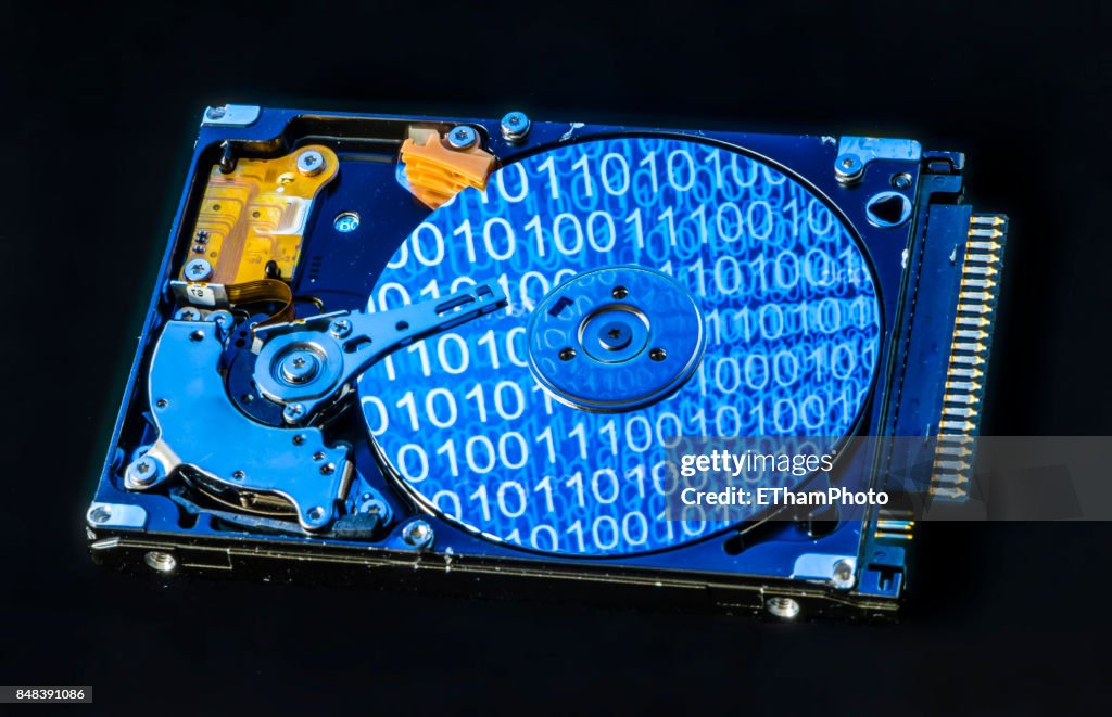Computer Hard Drive Disk With Binary Code Reflections High-Res Stock ...