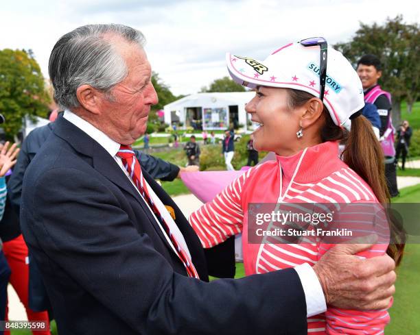 Ai Miyazato of Japan is greeted by golfing legend Gary Player of South Africa after her last competative round of golf during the final round of The...