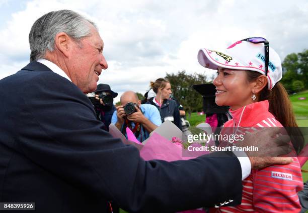 Ai Miyazato of Japan is greeted by golfing legend Gary Player of South Africa after her last competative round of golf during the final round of The...