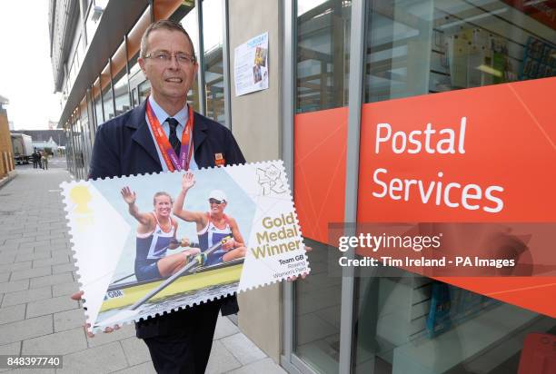 Veteran postman of 17 years, Doug Mowatt, from Temple Heath, delivers a giant Royal Mail stamp commemorating Great Britain's Gold Medal winner to the...