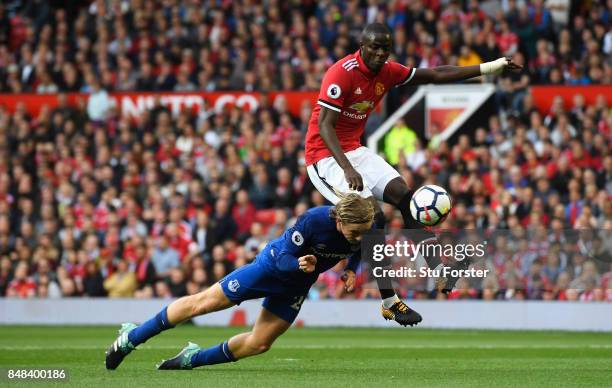 Tom Davies of Everton and Eric Bailly of Manchester United battle for possession during the Premier League match between Manchester United and...