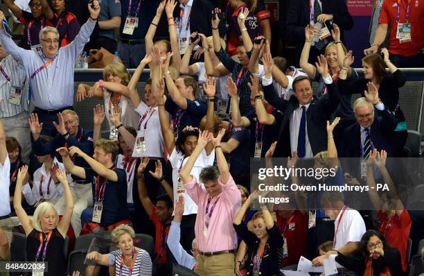 Prime Minister David Cameron, along with the Duke and Duchess of Cambridge take part in a Mexican wave during day six of the Olympic Games at the...