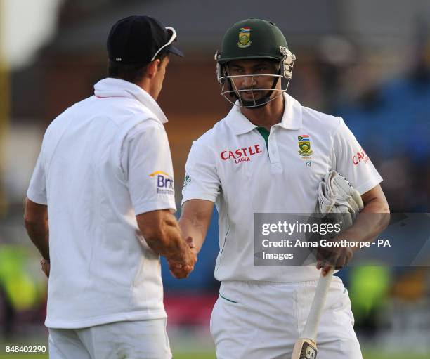 England's Andrew Strauss shakes hands with South Africa's Alviro Petersen as he finished the day on 124 not out during the Investec Second Test match...