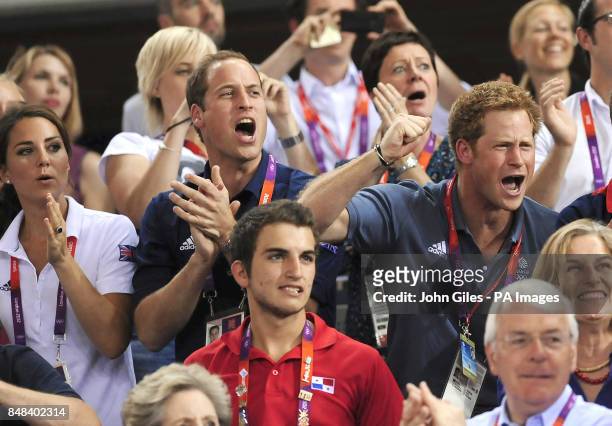 Prince Harry cheers on Great Britain in the Men's Team Sprint as he sits with the Duke and Duchess of Cambridge during day six of the Olympic Games...