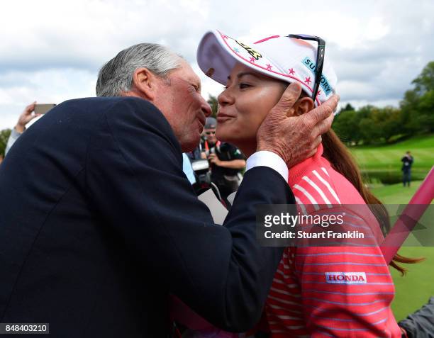 Ai Miyazato of Japan is greeted by golfing legend Gary Player of South Africa after her last competative round of golf during the final round of The...