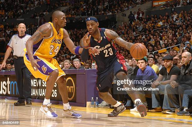 LeBron James of the Cleveland Cavaliers dribble drives to the basket against Kobe Bryant of the Los Angeles Lakers during the game at Staples Center...