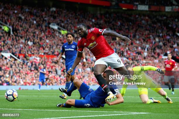 Phil Jagielka of Everton tackles Romelu Lukaku of Manchester United during the Premier League match between Manchester United and Everton at Old...