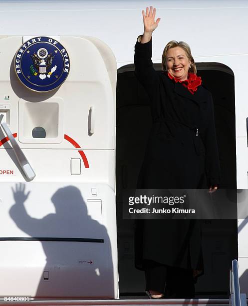 Secretary of State Hillary Clinton waves upon her departure at Tokyo International Airport on February 18, 2009 in Tokyo, Japan. Clinton is on her...