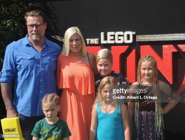 Actor Dean McDermott and actress Tori Spelling with their children arrive for the Premiere Of Warner Bros. Pictures' "The LEGO Ninjago Movie" held at...