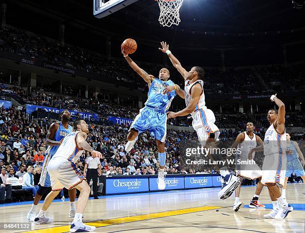 Dahntay Jones of the Denver Nuggets shoots a layup against Russell Westbrook of the Oklahoma City Thunder during the game at Ford Center on February...