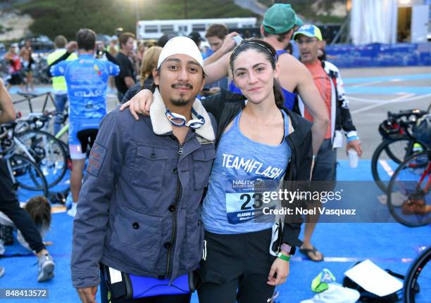 Actors Tony Revolori and Isabelle Fuhrman participate in the Nautica Malibu Triathlon at Zuma Beach on September 17, 2017 in Malibu, California.