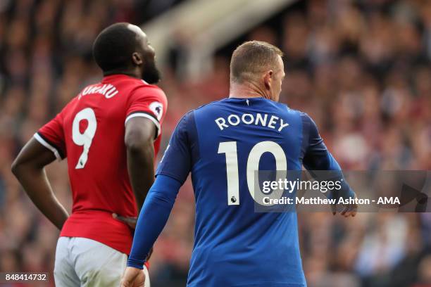 Romelu Lukaku of Manchester United is marked by Wayne Rooney of Everton as a corner is taken during the Premier League match between Manchester...