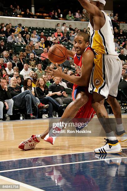 Andre Miller of the Philadelphia 76ers drives on T.J. Ford of the Indiana Pacers at Conseco Fieldhouse on February 17, 2009 in Indianapolis, Indiana....