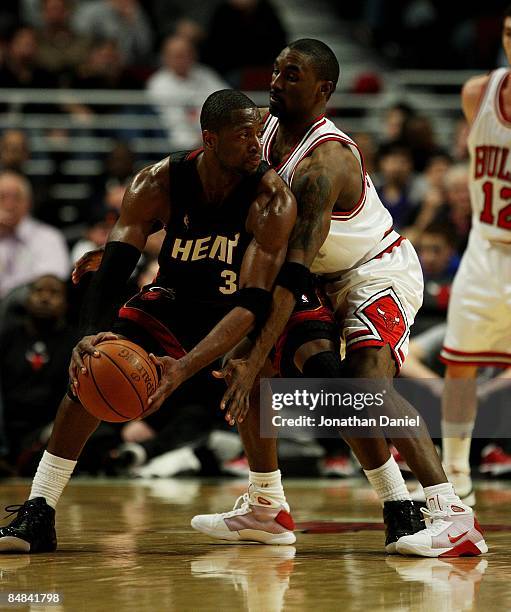 Dwyane Wade of the Miami Heat looks to pass as Ben Gordon of the Chicago Bulls defends on February 12, 2009 at the United Center in Chicago,...