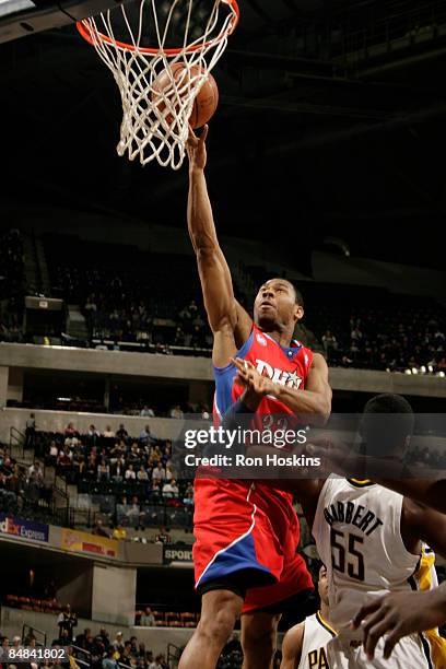 Willie Green of the Philadelphia 76ers lays the ball up over Roy Hibbert of the Indiana Pacers at Conseco Fieldhouse on February 17, 2009 in...