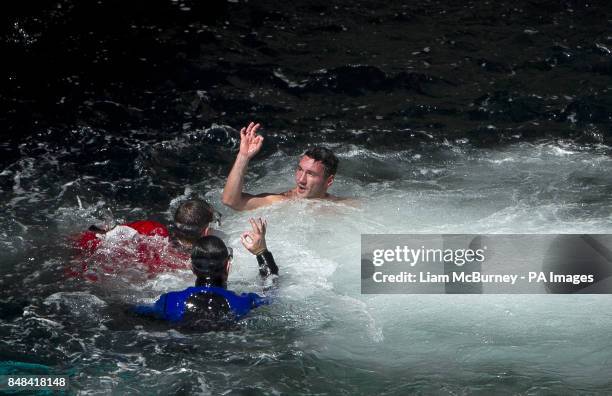 Great Britain's Blake Aldridge signalling he's OK after his dive, during the Red Bull 2012 Cliff Diving World Series at the Serpent's Lair, on the...