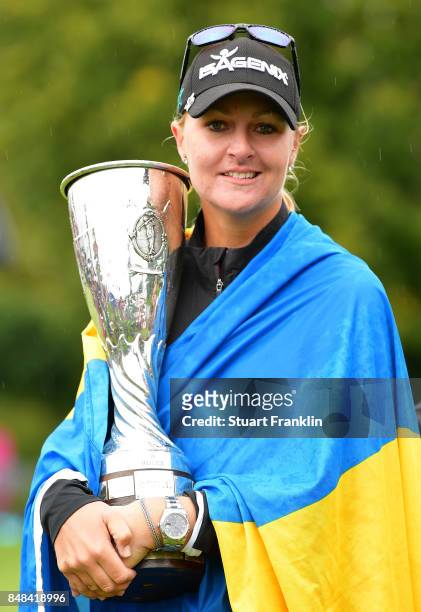 Anna Nordqvist of Sweden holds the trophy after winning during the play off after the final round of The Evian Championship at Evian Resort Golf Club...