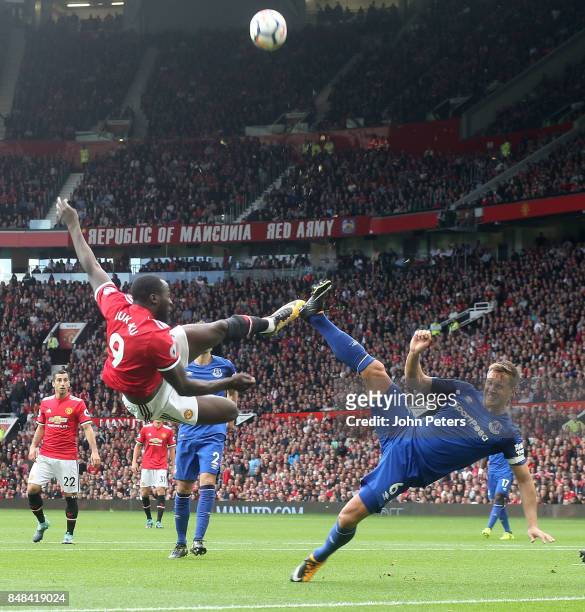 Romelu Lukaku of Manchester United in action with Phil Jagielka of Everton during the Premier League match between Manchester United and Everton at...