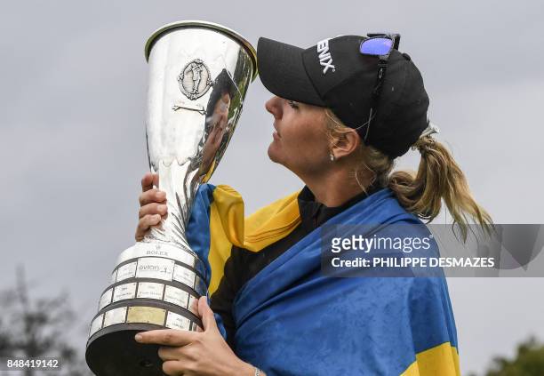 Anna Nordqvist from Sweden kisses her trophy after winning the Evian Championship tournament on September 17, 2017 in the French Alps town of...