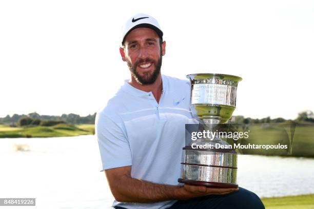 Romain Wattel of France poses with the trophy after winning on Day Four of the KLM Open at The Dutch on September 17, 2017 in Spijk, Netherlands.