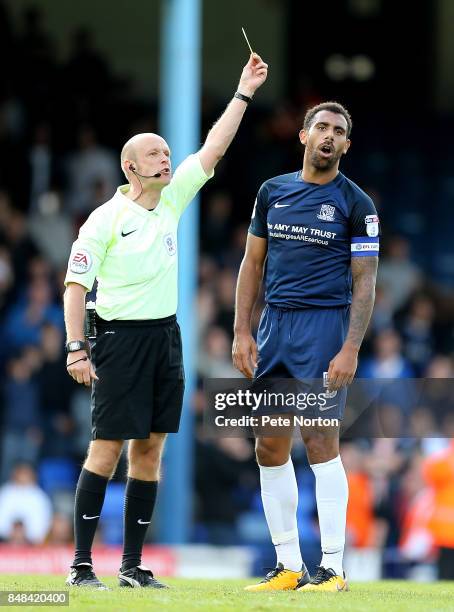 Referee Nicholas Kinseley shows a yellow card to Anton Ferdinand of Southend United during the Sky Bet League One match between Southend United and...