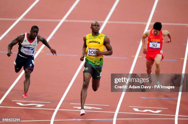 Jamaica's Usain Bolt and Great Britain's Dwain Chambers during the men's 100m semi final on day nine of the Olympic Games at the Olympic Stadium,...