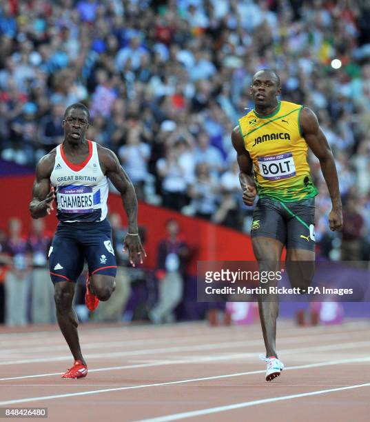 Great Britain's Dwain Chambers and Jamiaca's Usain Bolt compete in the Men's 100m Semi Final at the Olympic Stadium on day nine of the London 2012...