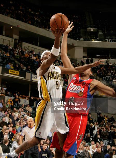 Ford of the Indiana Pacers shoots over Donyell Marshall of the Philadelphia 76ers at Conseco Fieldhouse on February 17, 2009 in Indianapolis,...