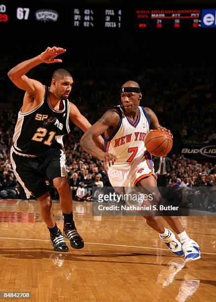 Al Harrington of the New York Knicks drives against Tim Duncan of the San Antonio Spurs on February 17, 2009 at Madison Square Garden in New York...