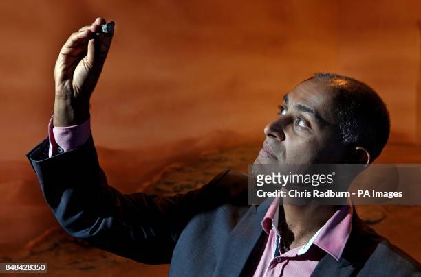 Anu Ojha Director of Space Academy at the National Space Centre holds a martian meteorite.