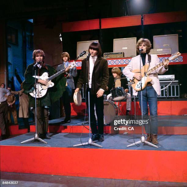 Photo of BYRDS and Chris HILLMAN and David CROSBY and Gene CLARK and Michael CLARKE and Roger McGUINN, Group performing at Wembley Studios L-R David...