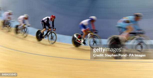 Great Britain's Ed Clancy on his way to winning bronze in the men's Omnium during the 15km scratch race event at the Olympic Velodrome, London, on...