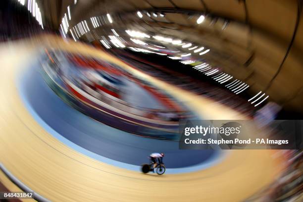 Great Britain's Ed Clancy on his way to winning bronze in the men's Omnium during the 15km scratch race event at the Olympic Velodrome, London, on...