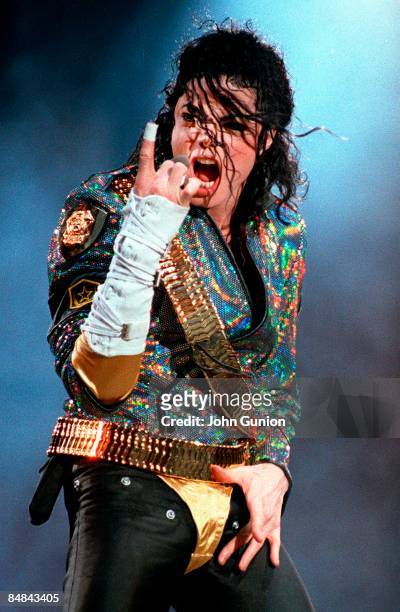 Photo of Michael JACKSON; Michael Jackson performing on stage, finger pointing up - Dangerous Tour
