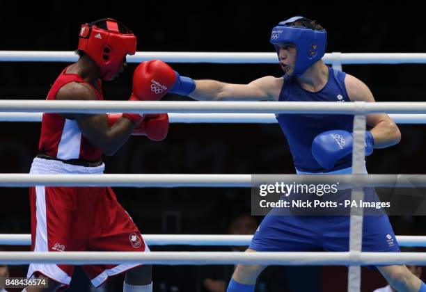 Great Britain's Freddie Evans receives a punch from Canada's Custio Clayton in their Men's boxing Welterweight 69kg bout at the Excel Arena, London.