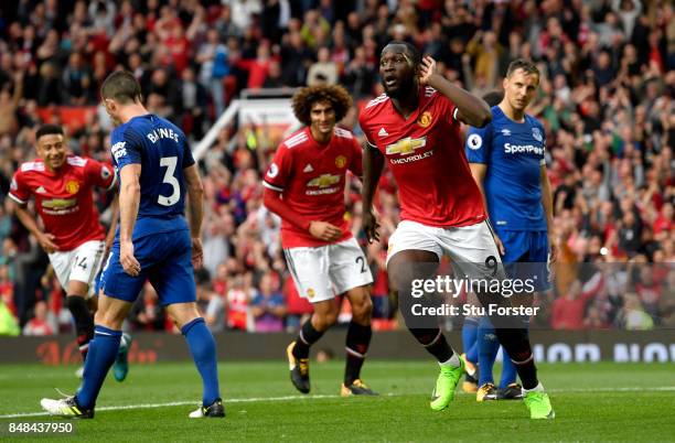 Romelu Lukaku of Manchester United celebrates scoring his sides third goal during the Premier League match between Manchester United and Everton at...