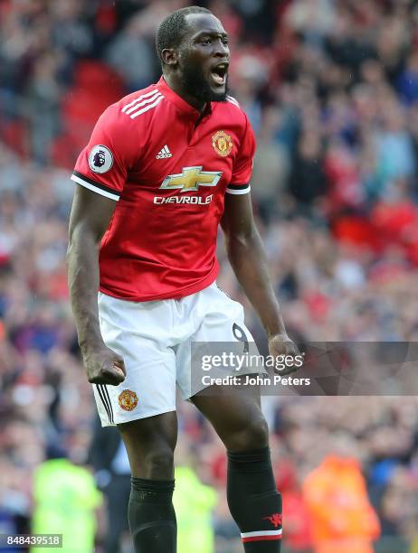 Romelu Lukaku of Manchester United celebrates scoring their third goal during the Premier League match between Manchester United and Everton at Old...