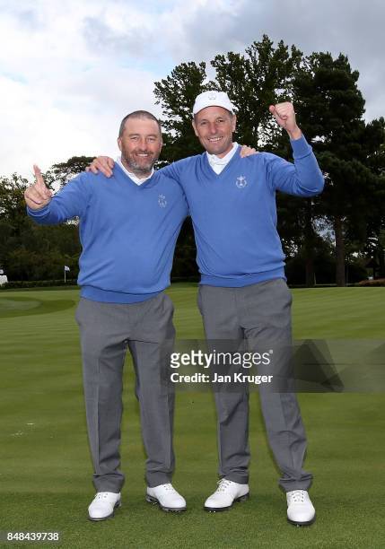 Damien McGrane and David Higgins celebrate after the the singles matches on the final day of the 28th PGA Cup at Foxhills Golf Course on September...