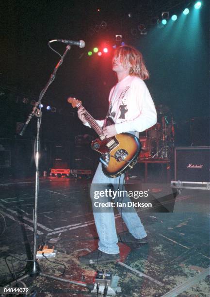 Photo of NIRVANA and Kurt COBAIN, Kurt Cobain performing live onstage, playing Fender Jaguar guitar