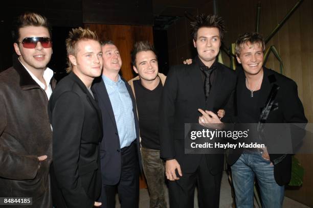 Photo of WESTLIFE and Louis WALSH; with their manager, Louis Walsh