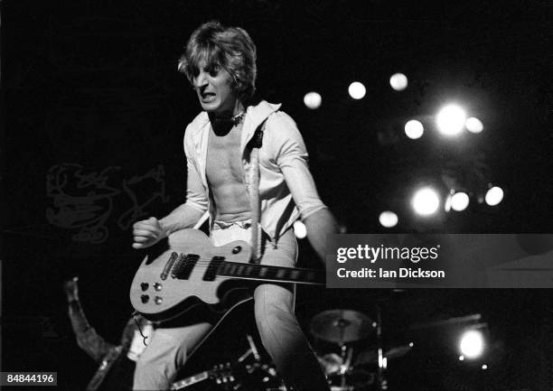 Guitarist Mick Ronson performs live on stage with the Hunter Ronson band at Hammersmith Odeon in London on 31st March 1975.