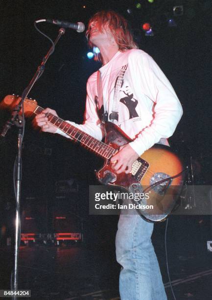 Photo of NIRVANA and Kurt COBAIN; Kurt Cobain performing live onstage, playing Fender Jaguar guitar,