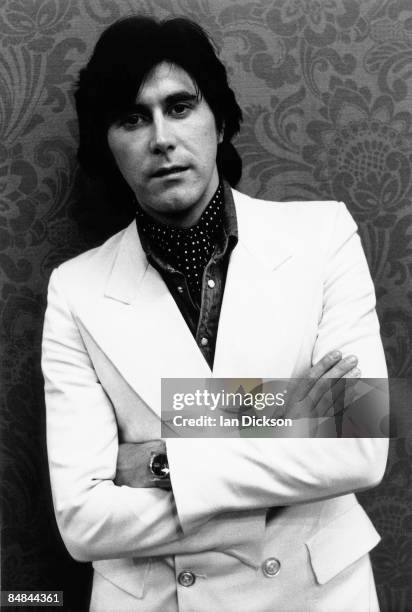 Photo of Bryan FERRY and ROXY MUSIC, lead singer with Roxy Music, posed, studio, wearing white suit on Stranded tour