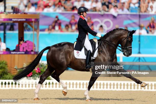 Great Britain's Charlotte Dujardin riding Valegro competes in the Equestrian Dressage Individual Grand Prix Freestyle at Greenwich Park during day 13...