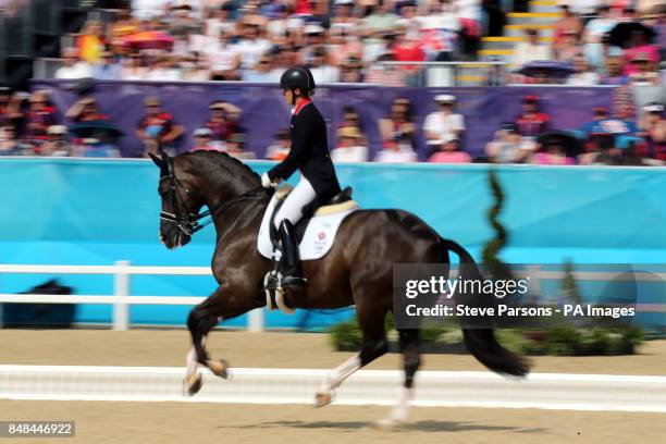 Great Britain's Charlotte Dujardin riding Valegro competes in the Equestrian Dressage Individual Grand Prix Freestyle at Greenwich Park during day 13...